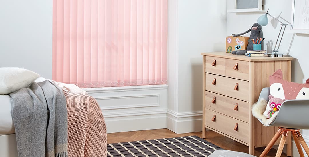 Light entering through children's bedroom vertical blinds