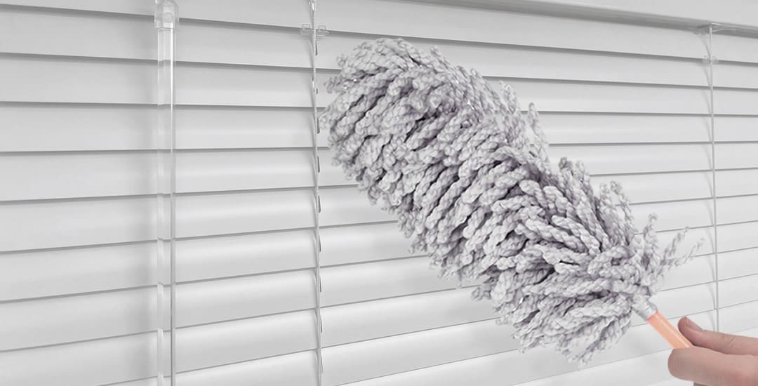 Remove dust from venetian blinds with a duster