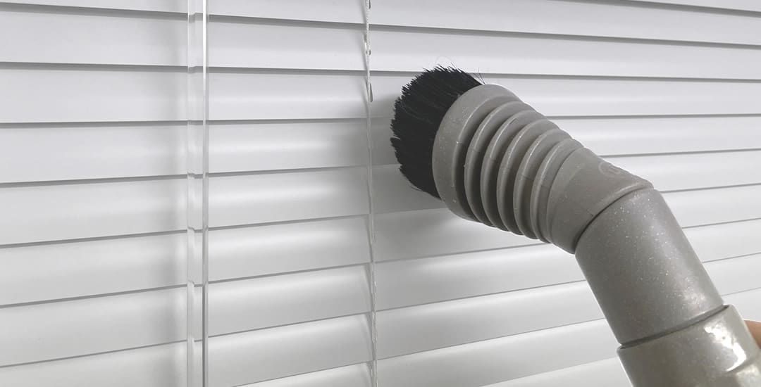 Vacuum venetian blinds clean with brush attachment