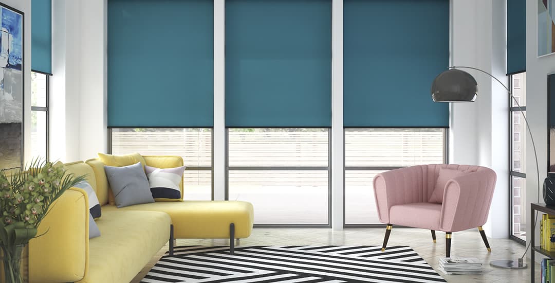 Blue roller blinds in long window