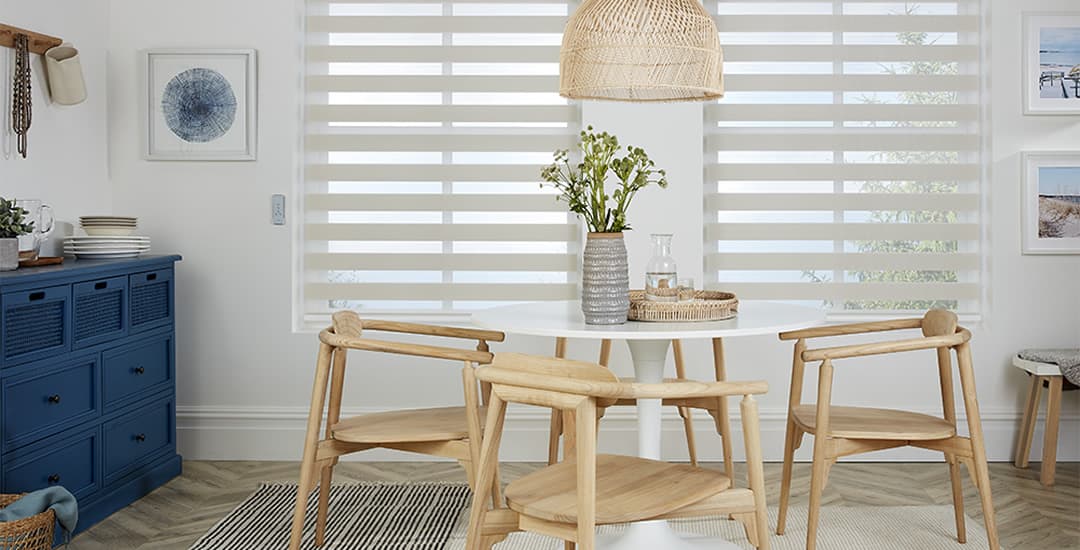 Grey day and night blinds in dining room