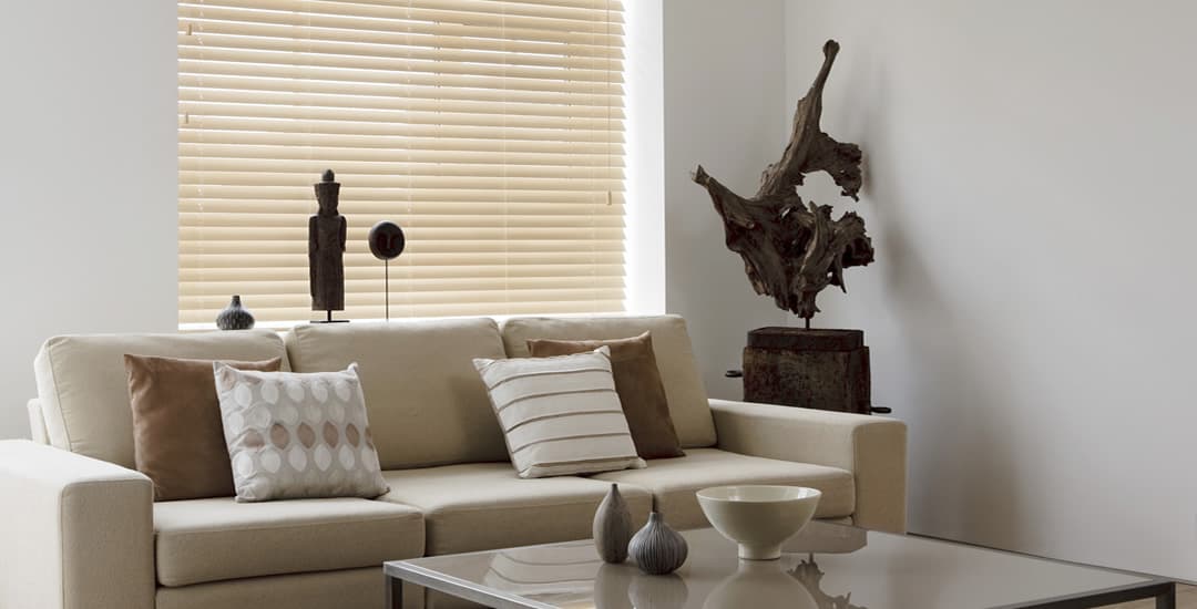 Light maple wooden blinds in lounge