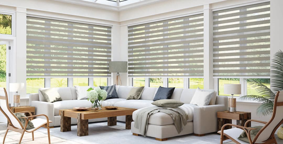 Taupe day and night blinds in conservatory