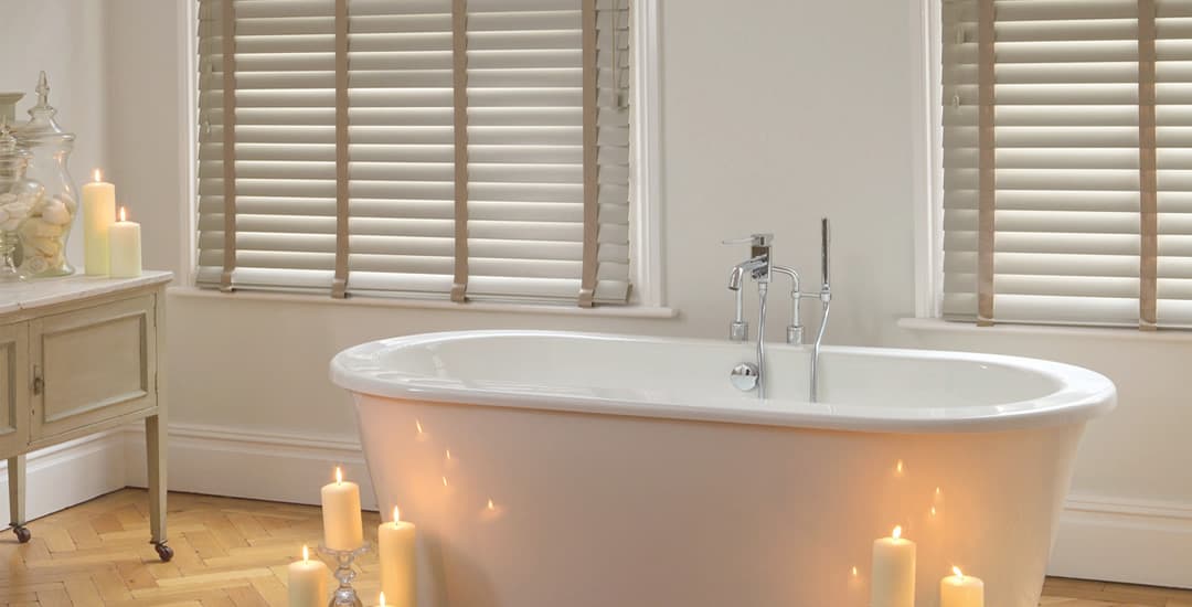 Beige faux wood blinds in bathroom