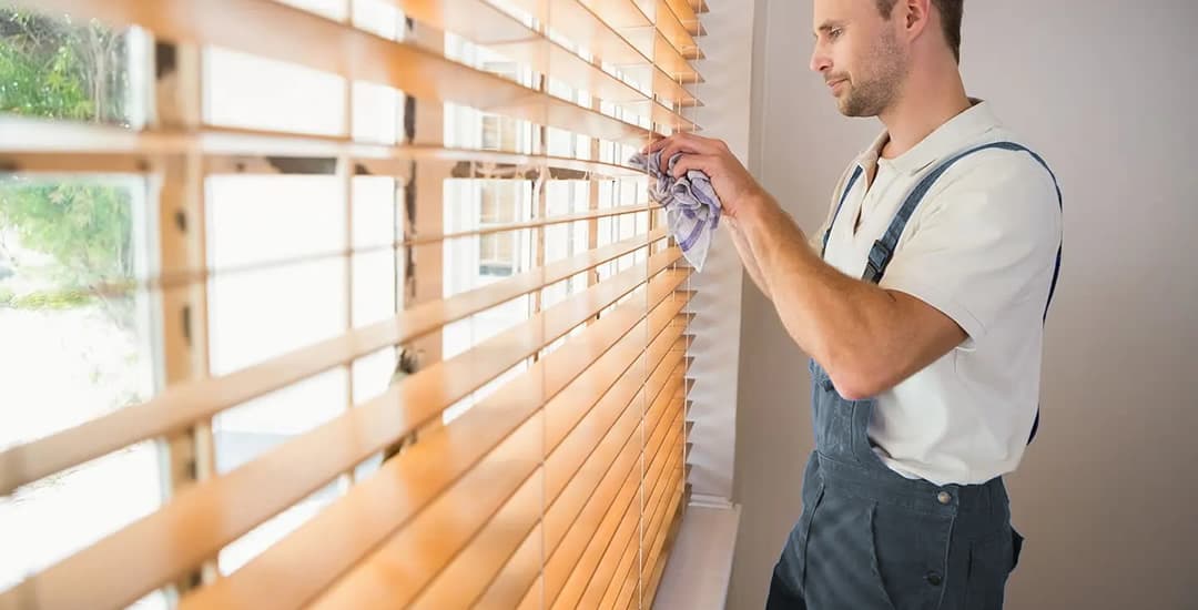 Cleaning wooden blinds slat by slat
