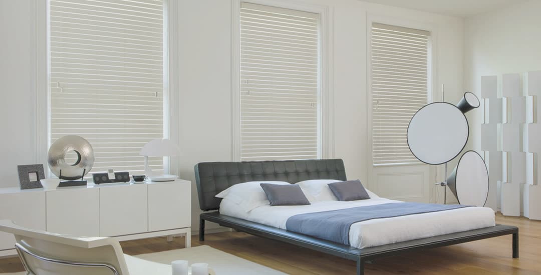 Cream faux wood blinds in bedroom