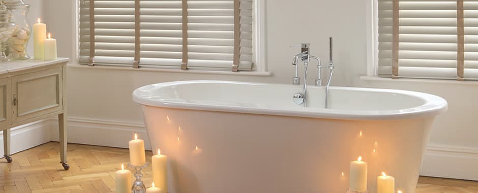Faux wood blinds in bathroom with candles