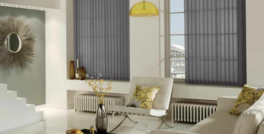 Grey vertical blinds in retro living room
