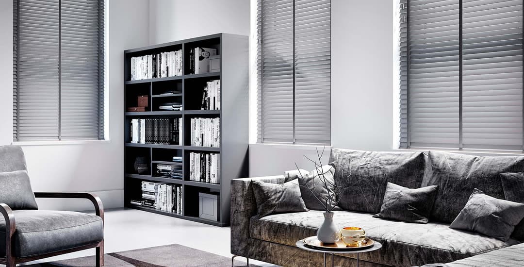 Grey wooden blinds with tapes in living room