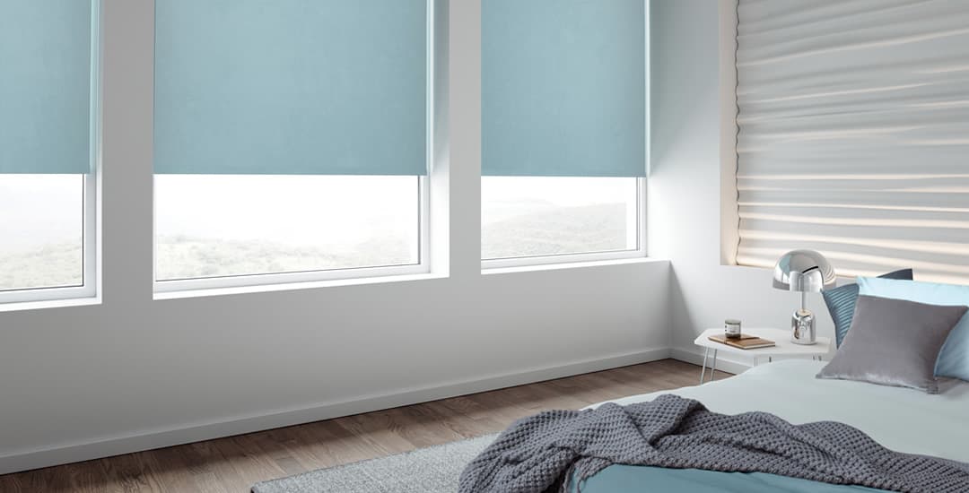 Blue blackout blinds in bedroom