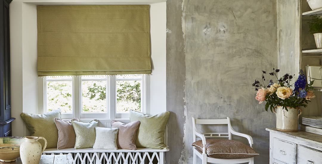 Luxury ochre roman blinds in dining room