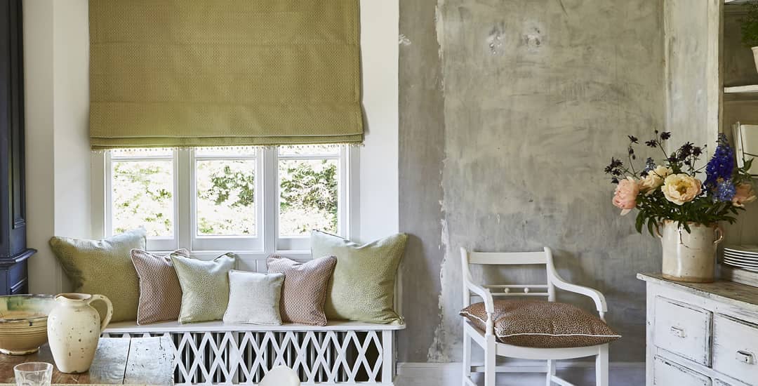 Ochre blackout roman blinds in dining room