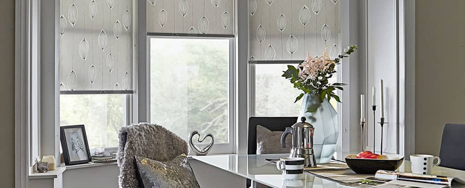 Patterned roller blinds in three-sided bay window