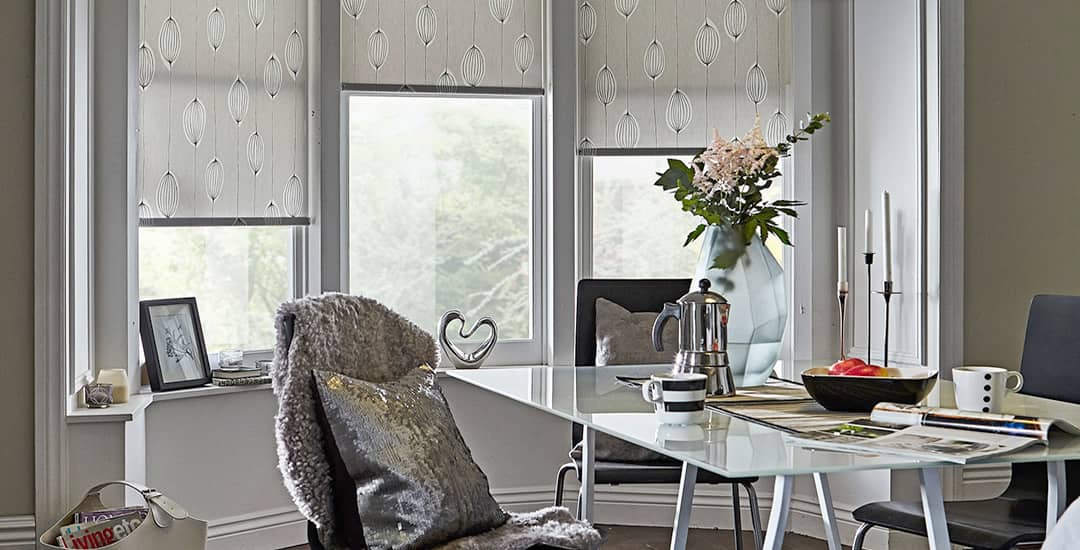 Patterned roller blinds in three-sided bay window