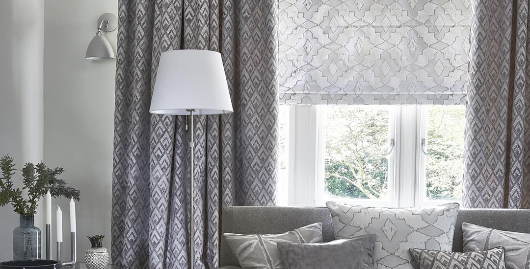 Silver patterned roman blinds in lounge