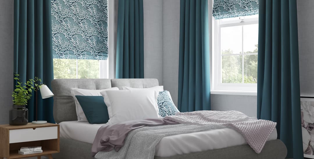 Blue roman blinds in bedroom
