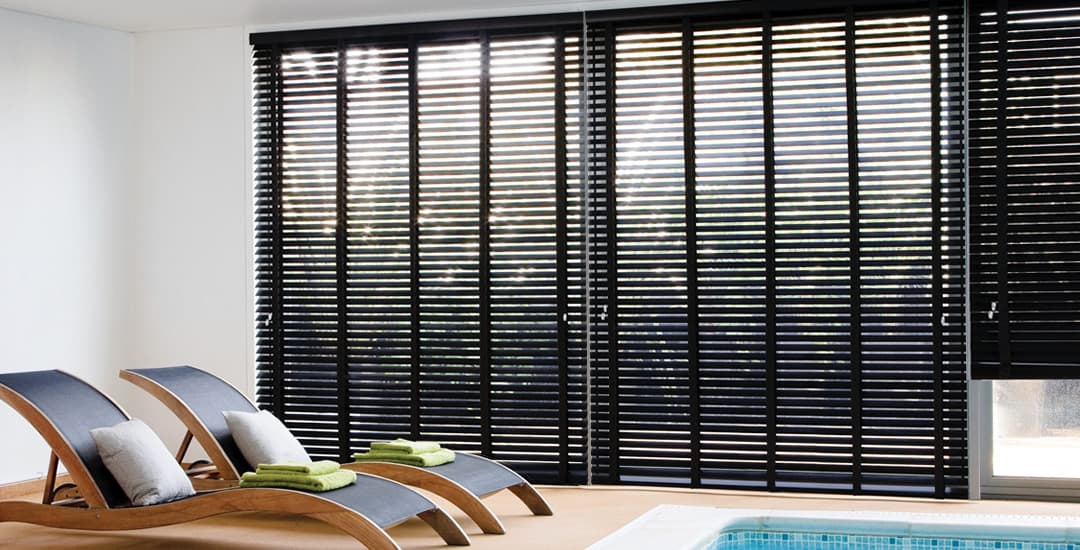 Black venetian blinds on bifold doors