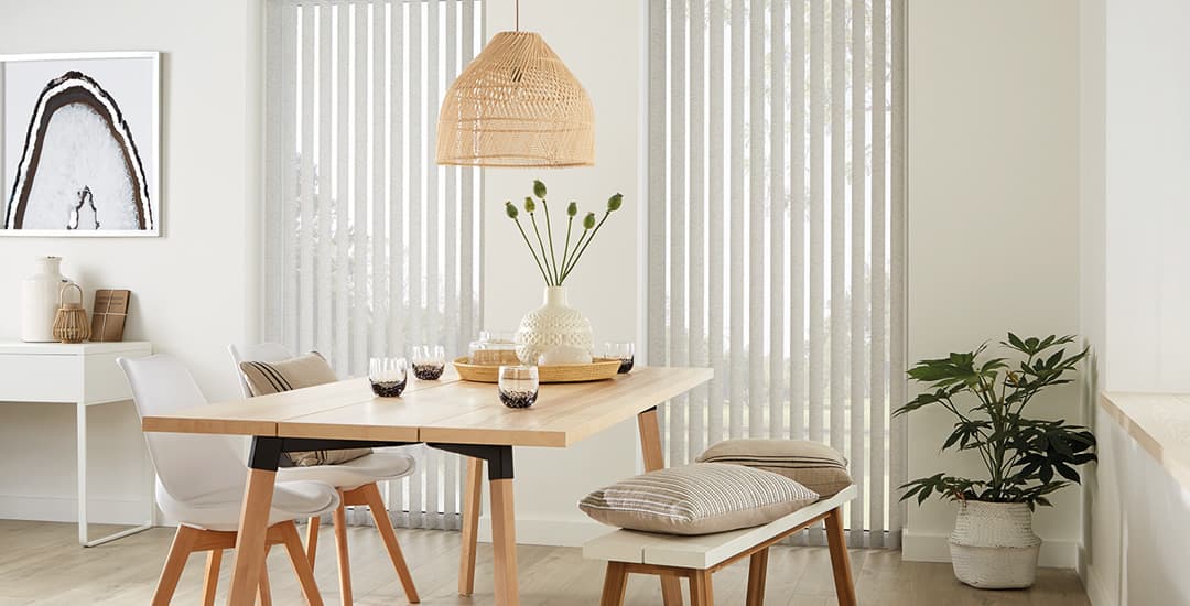 Beige vertical blinds in dining room