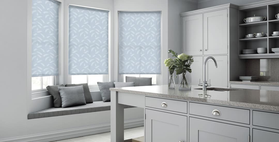 Blue patterned roller blinds in contemporary grey kitchen