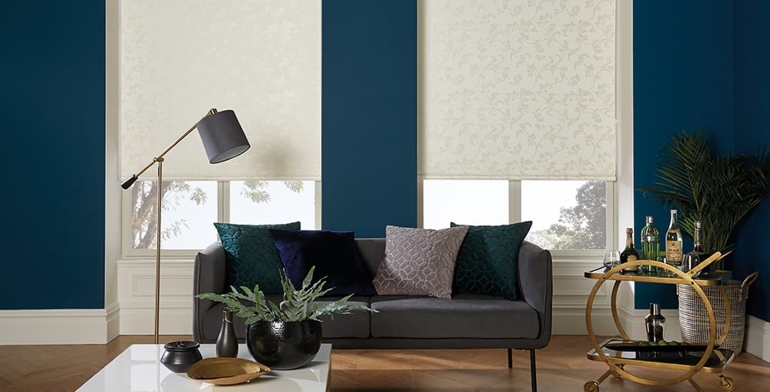 Cream floral blackout roller blinds in blue lounge