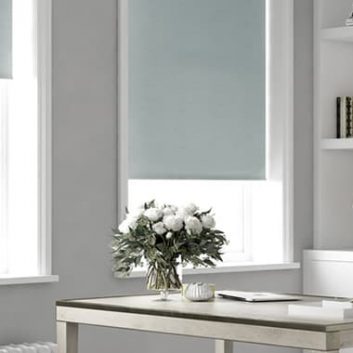 Duck egg blackout roller blinds in grey and white room