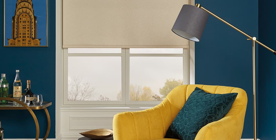 Golden beige fabric roller blinds in blue lounge