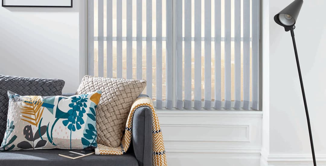 Grey vertical blinds in living room 