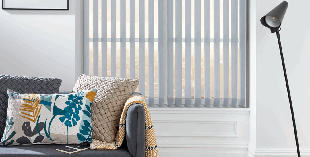 Grey vertical blinds in living room