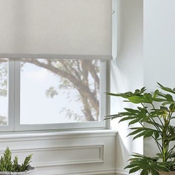 Plain mushroom beige roller blind in living room