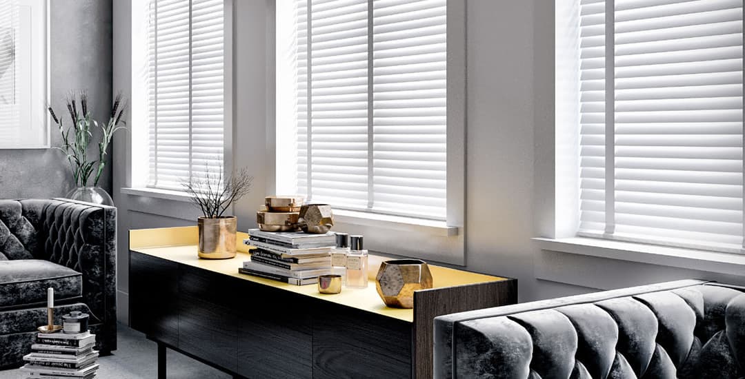 White wooden blinds with tapes in grey living room