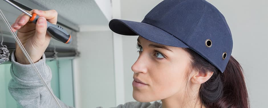 Woman removing venetian blinds