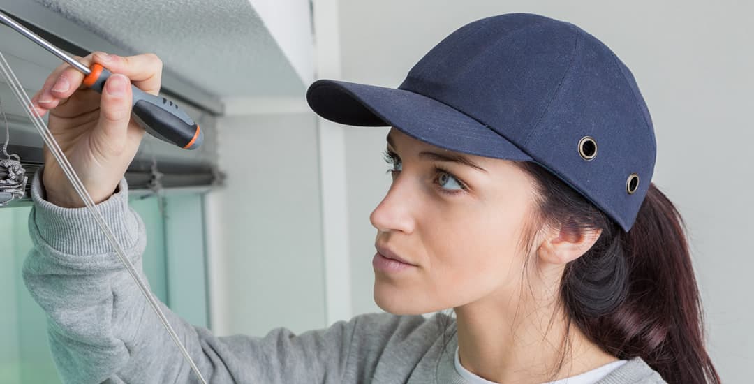 Woman removing venetian blinds