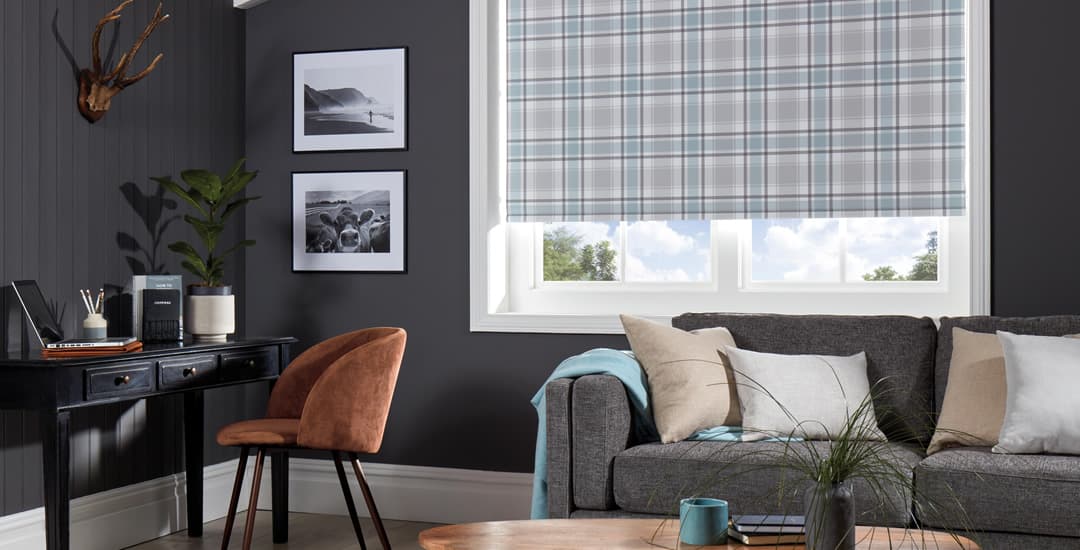 Blue tartan patterned roller blinds in dark grey lounge