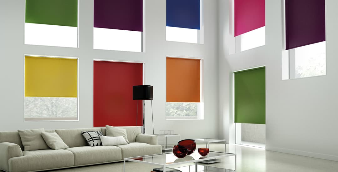 Colourful collection of roller blinds in living room
