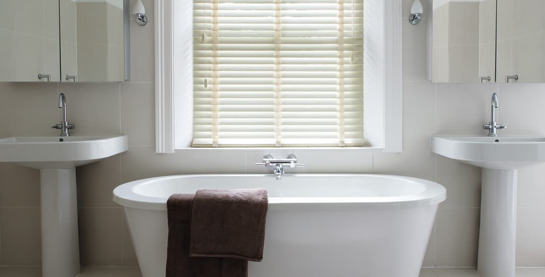 Cream waterproof faux wood blinds in bathroom