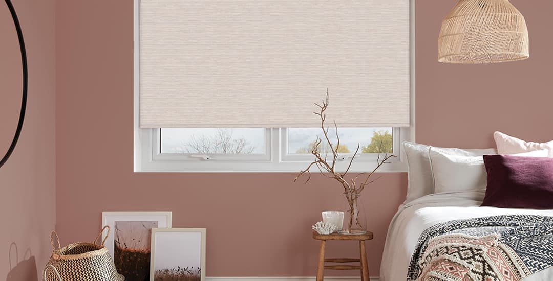 Textured blackout roller blinds in bedroom