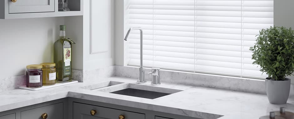 White wooden blinds in kitchen