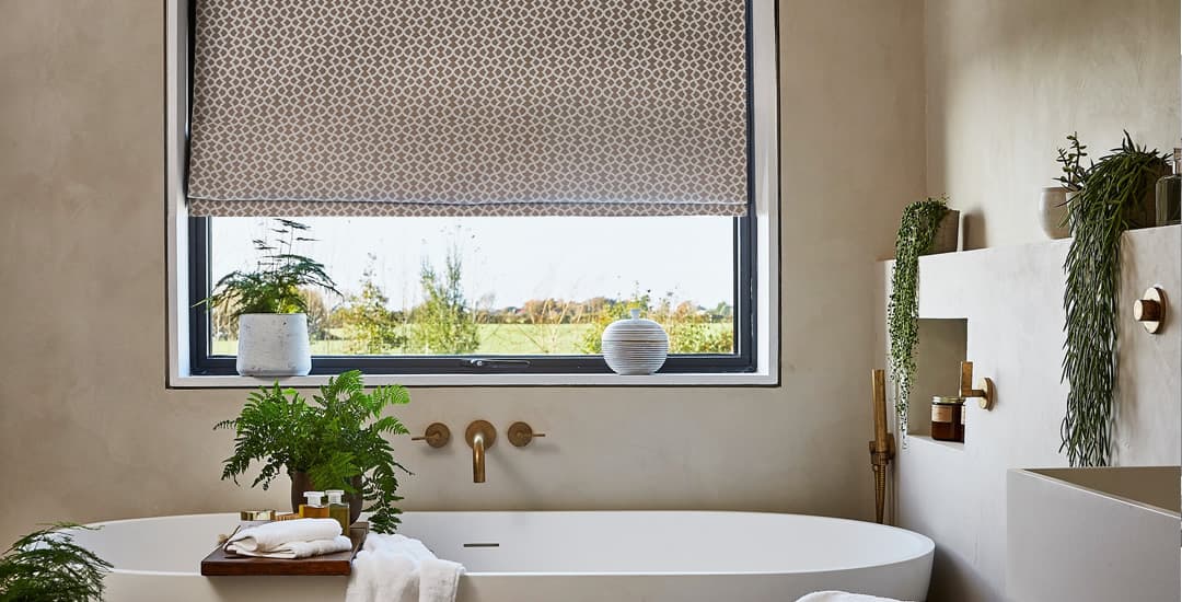 Brown geometric patterned roman blinds in bathroom