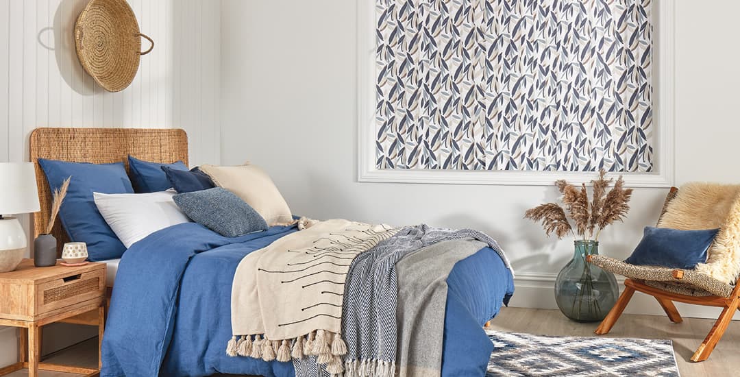 Colourful leaf patterned blackout vertical blinds in bedroom