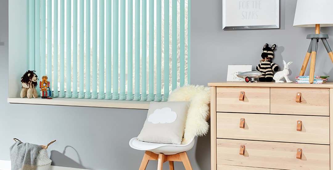 Green pvc waterproof vertical blinds in kids’ playroom