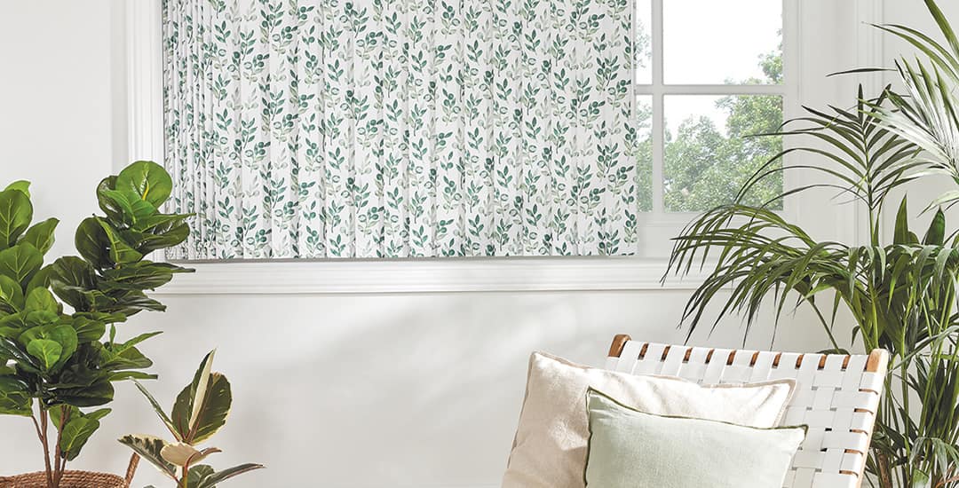 Luxury floral vertical blinds hanging just above the windowsill