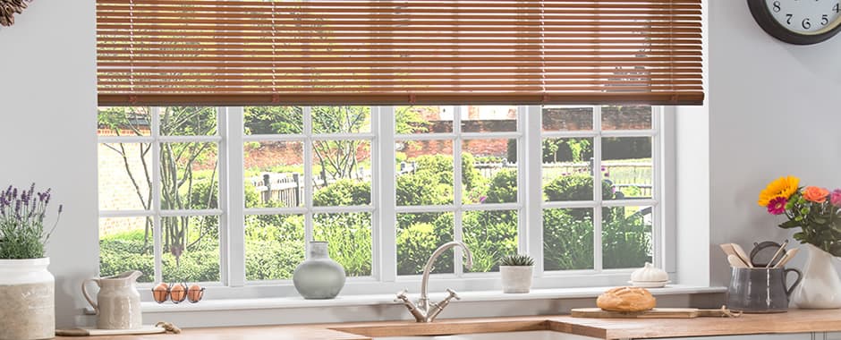 Brown aluminium venetian blinds in kitchen