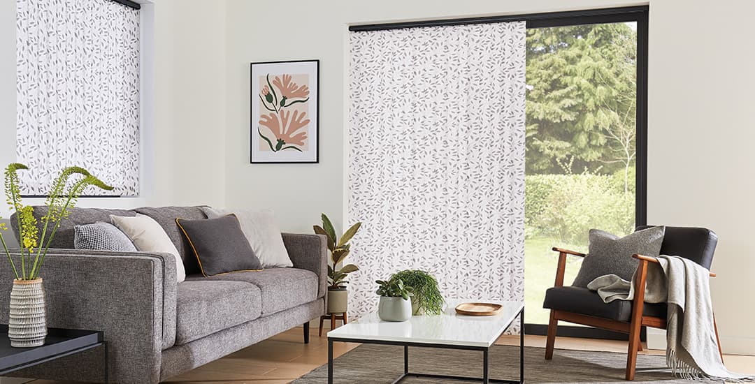 Grey and white floral patio door vertical blinds in living room