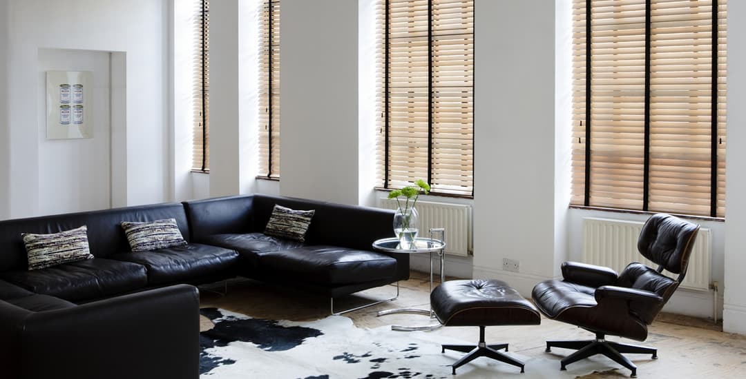 Taped real wooden blinds in modern white living room