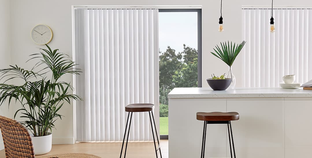 White patio door vertical blinds in contemporary kitchen