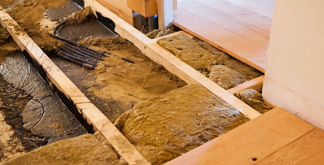 Floor insulation being installed