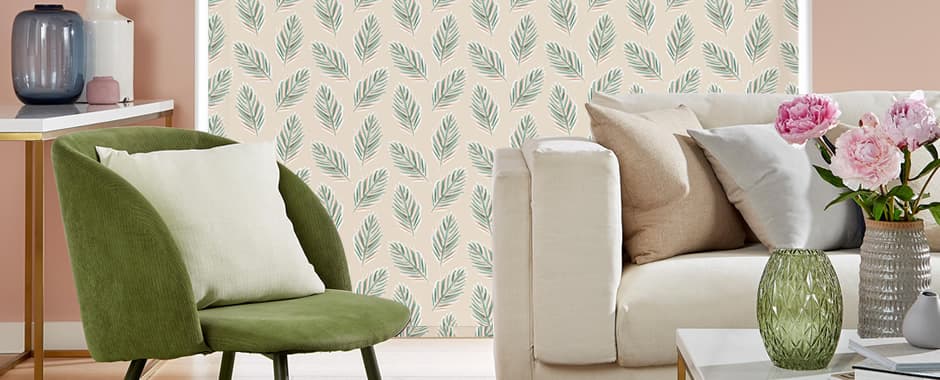 Long tropical leaves patterned roller blinds nearly touching the floor