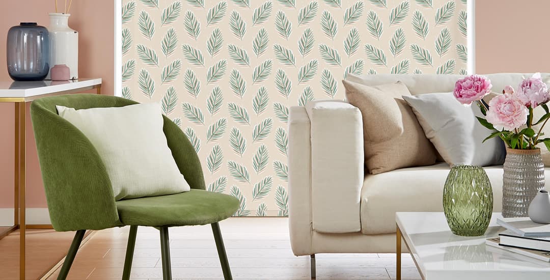 Long tropical leaves patterned roller blinds nearly touching the floor