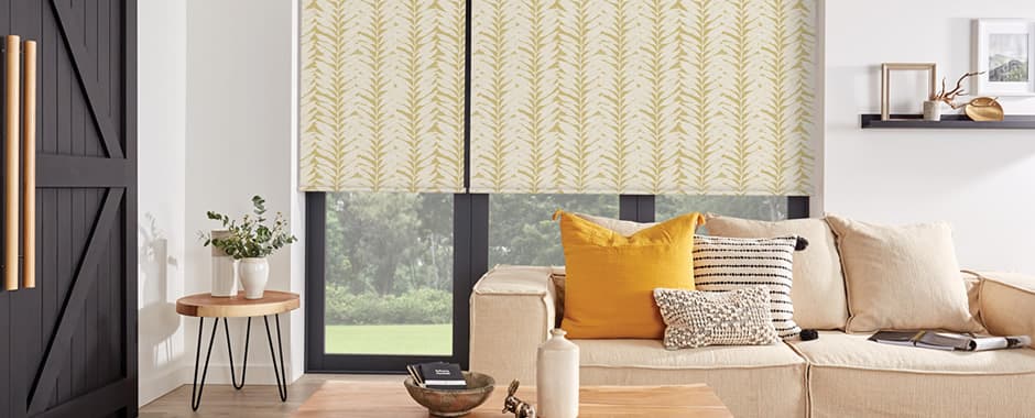 Ochre leaf patterned blackout roller blinds in living room