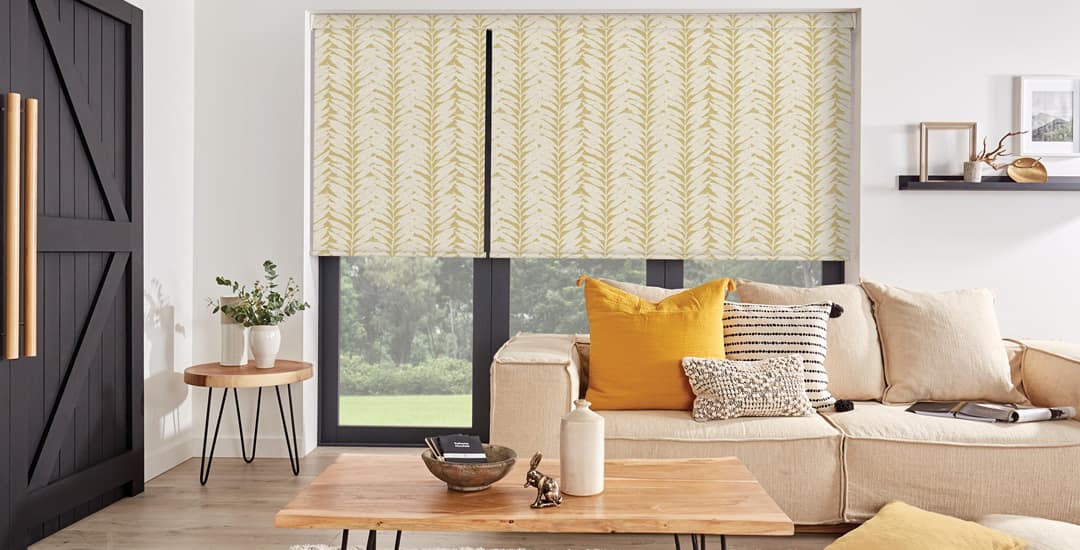 Ochre leaf patterned blackout roller blinds in living room